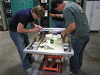 Wade (left) and Larry (right) working on the robot