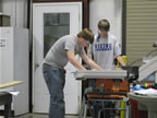 Wade (left) and Matt (right) working on the table saw