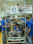 Team working on the bot in the pit